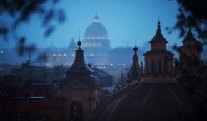 Rainy day in Rome: tourists with umbrellas