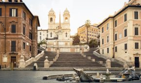 Piazza di Spagna with Fontana della Barcaccia and the Spanish Steps (Rome, Italy).